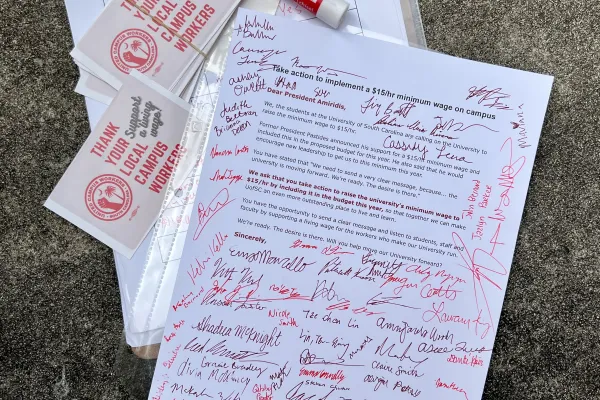 $15 minimum wage open letter delivered to Amiridis at Imagine Carolina event