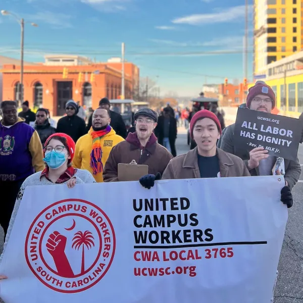 Union members march with banner